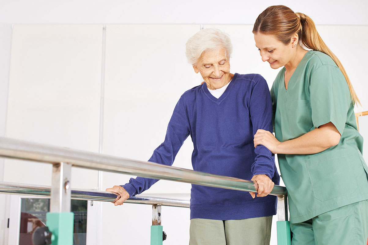 Elderly woman using ramp with assistance.